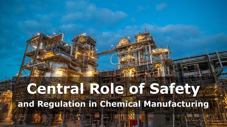 A vast industrial chemical plant with numerous intertwined pipes, storage tanks, and tall processing vessels under a clear sky