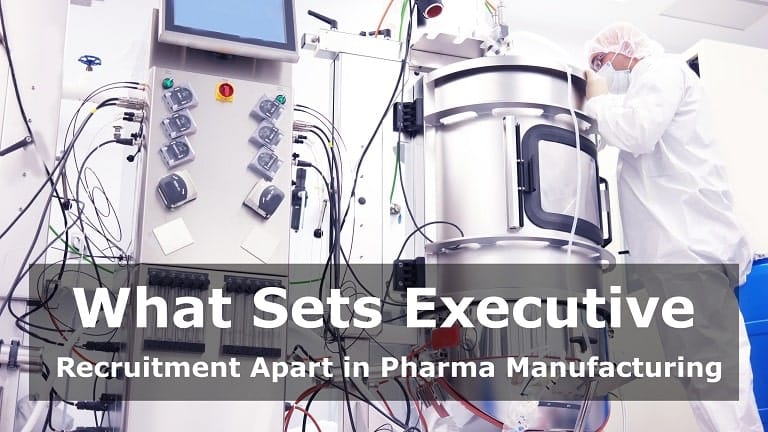 A large, gleaming stainless steel bioreactor in a modern biopharmaceutical manufacturing facility.